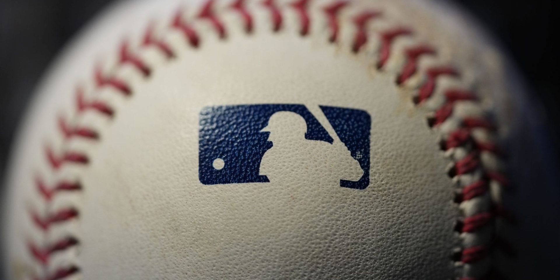 The Major League logo is seen on a baseball, Wednesday, Feb. 22, 2023, in Marple Township, Pa. (AP Photo/Matt Slocum)