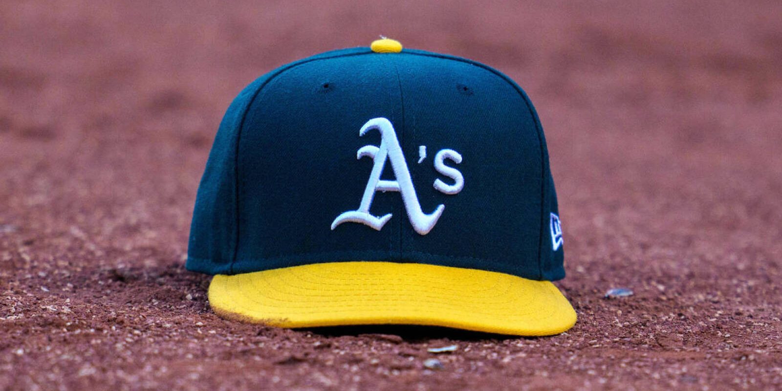 May 26, 2022; Oakland, California, USA; Oakland Athletics baseball hat on the field of play during the third inning after the called third strike of Oakland Athletics designated hitter Jed Lowrie (not pictured) at RingCentral Coliseum. Mandatory Credit: Neville E. Guard-USA TODAY Sports