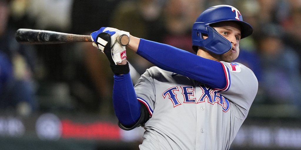Texas Rangers' Corey Seager follows through during an at-bat in a baseball game against the Seattle Mariners, Saturday, Sept. 30, 2023, in Seattle. (AP Photo/Lindsey Wasson)