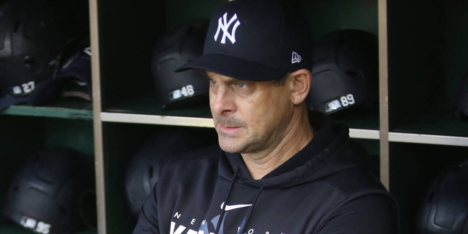 Sep 16, 2023; Pittsburgh, Pennsylvania, USA; New York Yankees manager Aaron Boone (17) looks on from the dugout against the Pittsburgh Pirates at PNC Park. Mandatory Credit: Charles LeClaire-USA TODAY Sports