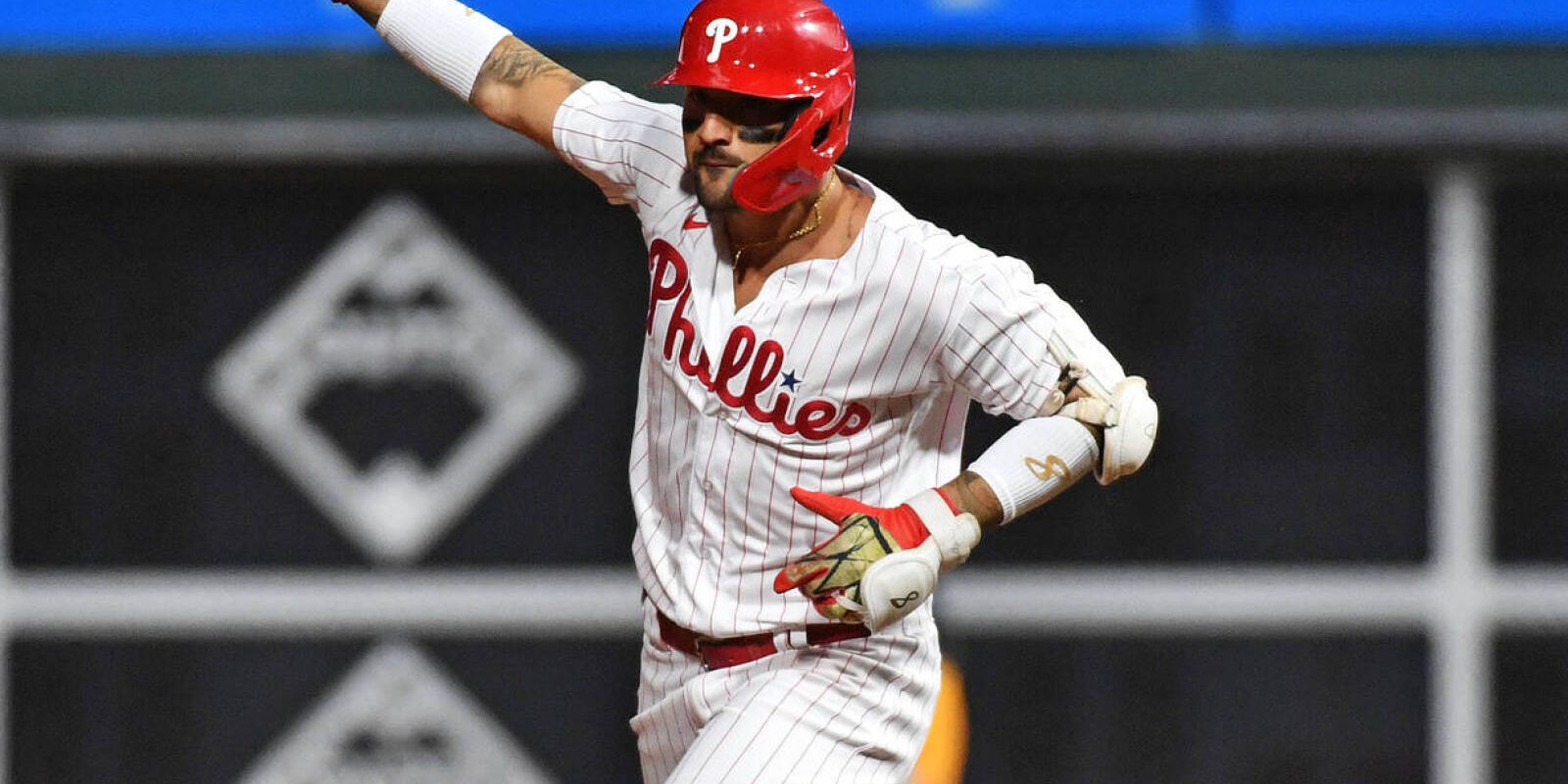 Oct 11, 2023; Philadelphia, Pennsylvania, USA; Philadelphia Phillies right fielder Nick Castellanos (8) hits a solo home run during the eighth inning against the Atlanta Braves in game three of the NLDS for the 2023 MLB playoffs at Citizens Bank Park. Mandatory Credit: Eric Hartline-USA TODAY Sports